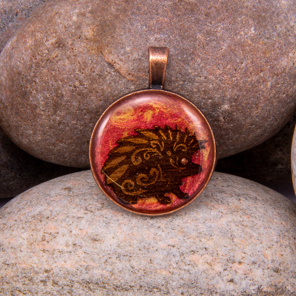 Handcrafted Bespoke Happy Hedgehog Pendant; set in Copper Effect metal bezel.| Jabbawocky Crafts (jabbawockycrafts.co.uk)