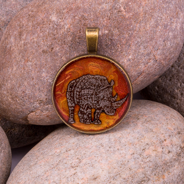 Handcrafted Bespoke Mighty Rhino Pendant; set in bronze effect metal bezel.| Jabbawocky Crafts (jabbawockycrafts.co.uk)