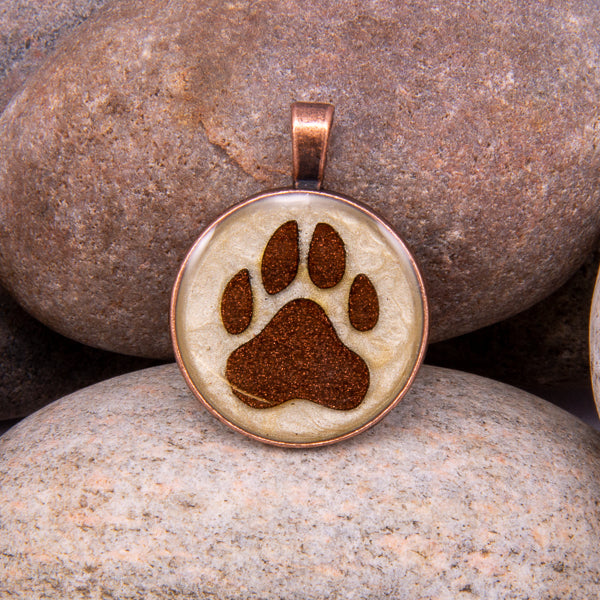 Handcrafted Bespoke Dog Paw Print Pendant; set in Copper Effect metal bezel.| Jabbawocky Crafts (jabbawockycrafts.co.uk)