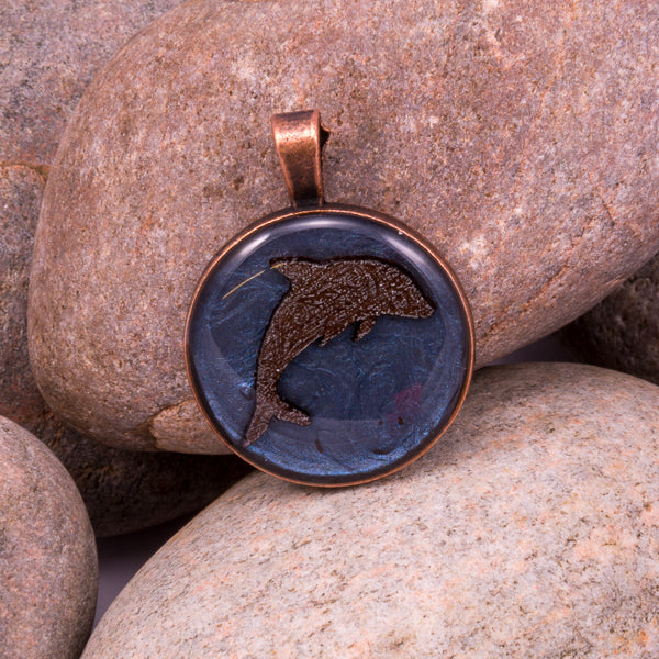 Handcrafted Bespoke Leaping Dolphin Pendant; set in copper effect metal bezel.| Jabbawocky Crafts (jabbawockycrafts.co.uk)