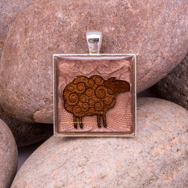 Handcrafted Bespoke Woolly Sheep Pendant; set in silver effect metal bezel.| Jabbawocky Crafts (jabbawockycrafts.co.uk)
